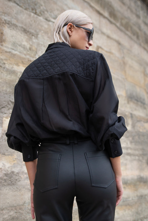 Black silk shirt with an oversize fit and chest pockets