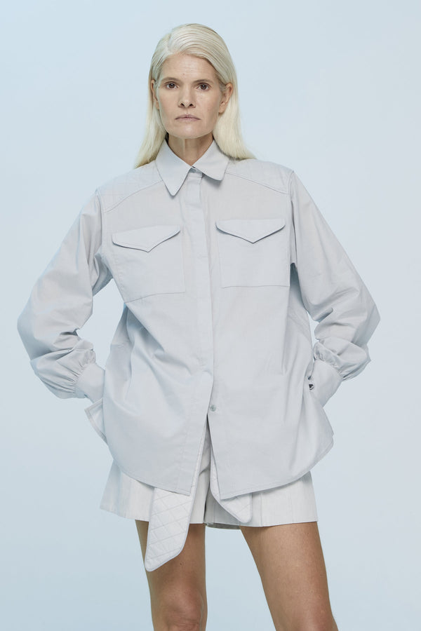Grey cotton shirt with an oversize fit and chest pockets