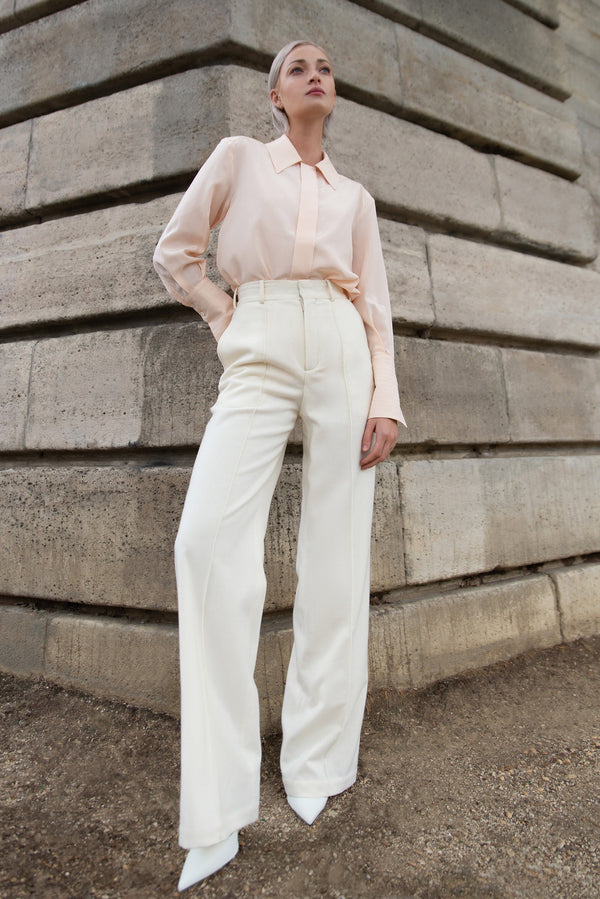 White wool pant with a flared cut and high waist